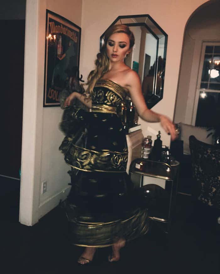 Peyton gives her Carolina Herrera dress a twirl